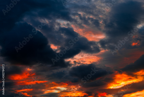 Beautiful sunset. Red and black clouds in the sky © E.O.