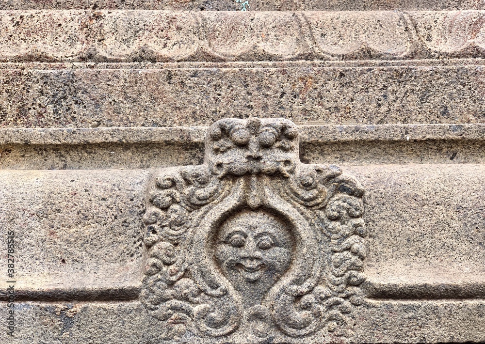 Bas relief sculpture carved in the walls of Kapaleeshwarar temple in Tamilnadu. Texture design in the walls of the ancient temple.