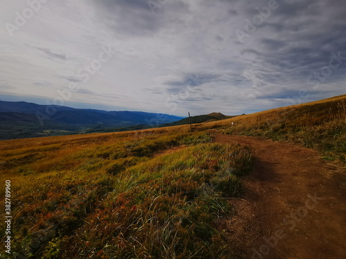 Carpathians European Mountains. Autumn colors of the mountains. Cloudy sky.Mountains in autumn. photo