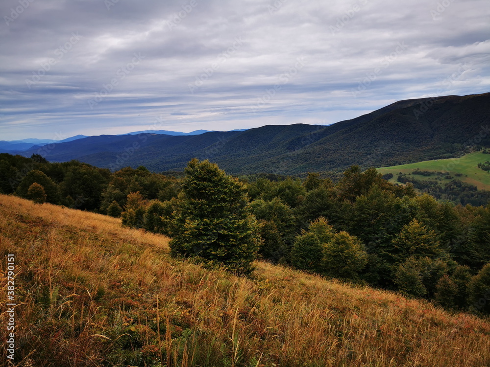Carpathians European Mountains. Autumn colors of the mountains. Cloudy sky.Mountains in autumn.