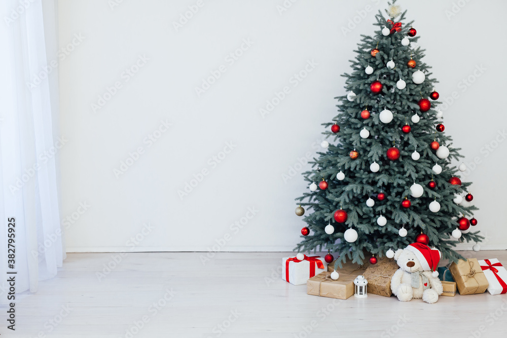 Christmas tree blue pine with gifts decor interior of the white room new year