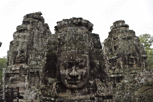 faces carved in stone in a temple in Cambodia 