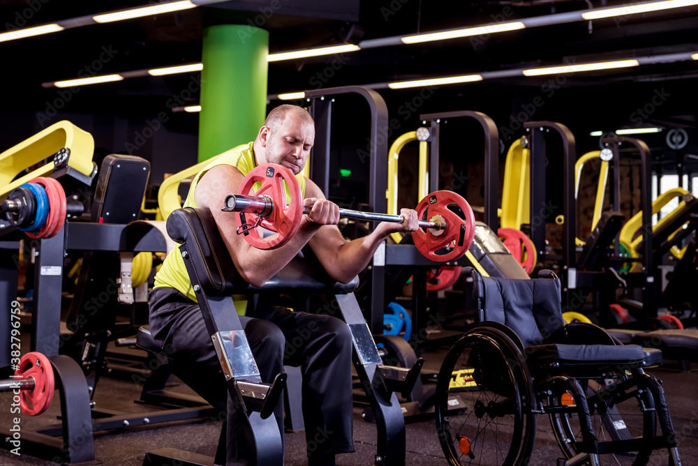 Disabled man training in the gym of rehabilitation center Disabled man training in the gym of rehabilitation center