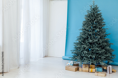 Christmas tree blue pine with gifts interior decor room New year winter holidays