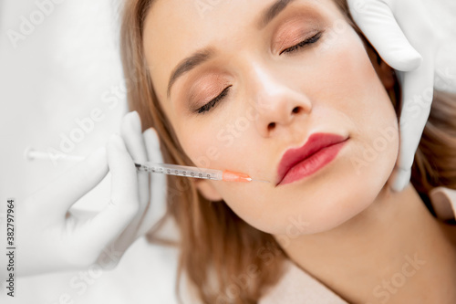Correction injections form of lips. Spa beauty facial rejuvenation