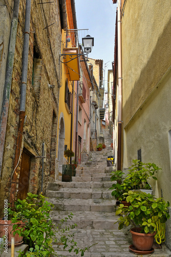 A narrow street among the old houses of Mirabello Sannitico  a medieval village in the province of Campobasso  Italy