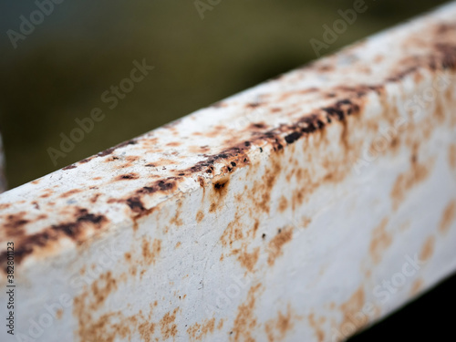 Rust and corrosion in the fence bar and metal skin