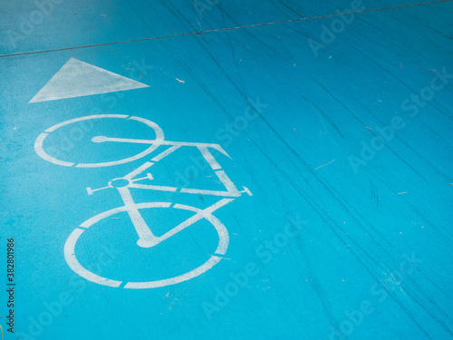 Bicycle sign on the road in city park 