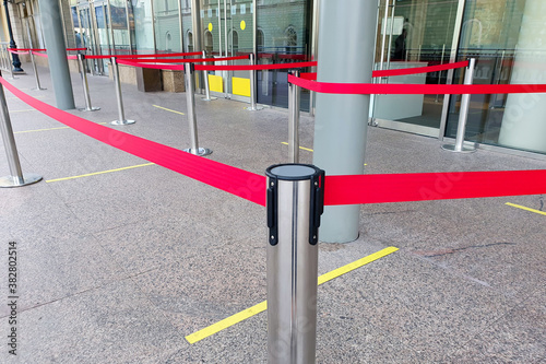 Empty paths bounded by a red ribbon. Tape security at the airport.