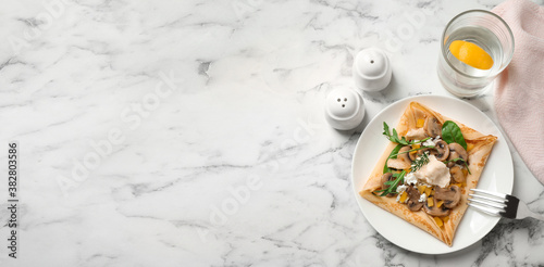 Delicious breakfast with thin pancake on marble table, flat lay. Banner design, space for text