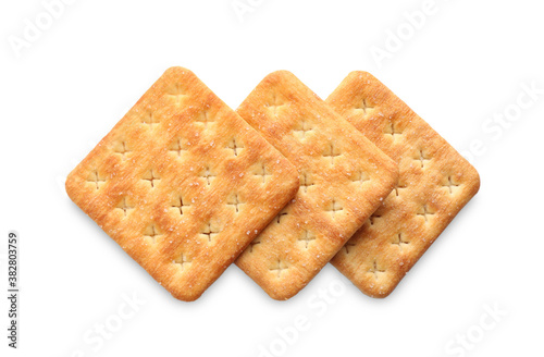 Delicious crispy crackers isolated on white, top view