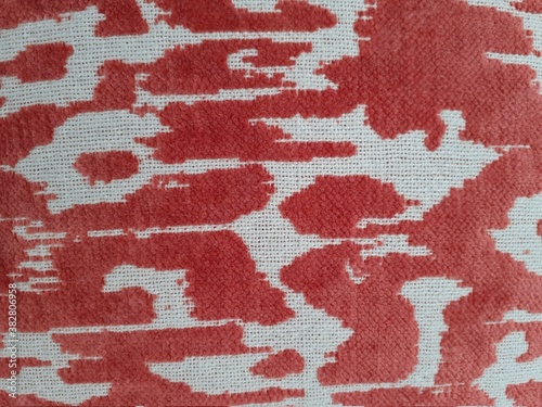 Background from a textile material red and white. Fabric with natural texture.