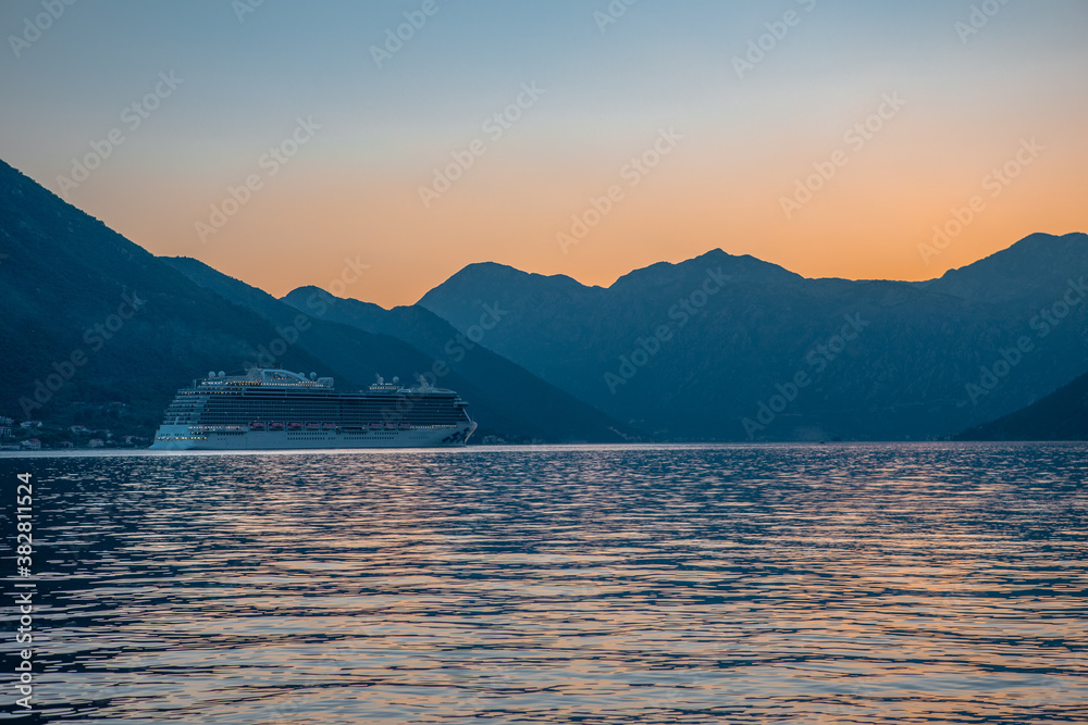 Sunset view of Kotor Bay in Montenegro,  with mountains and sea.