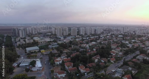 Aerial View of Yehud Monosson, Israel. Residential Neighborhood Buildings and New Construction Developments in Twilight During Covid-19 Virus Outbreak and Lockdown, Drone Shot photo