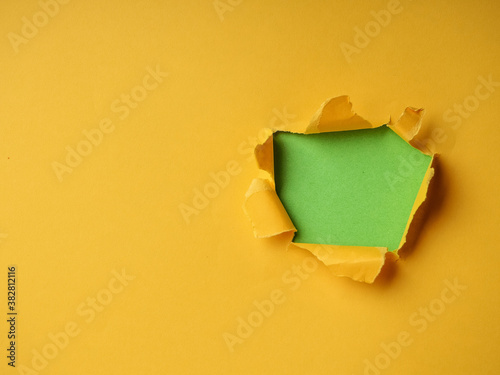 Ripped Paper Hole with green and yellow coloured background