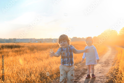 Children outdoors in a field © alexkich