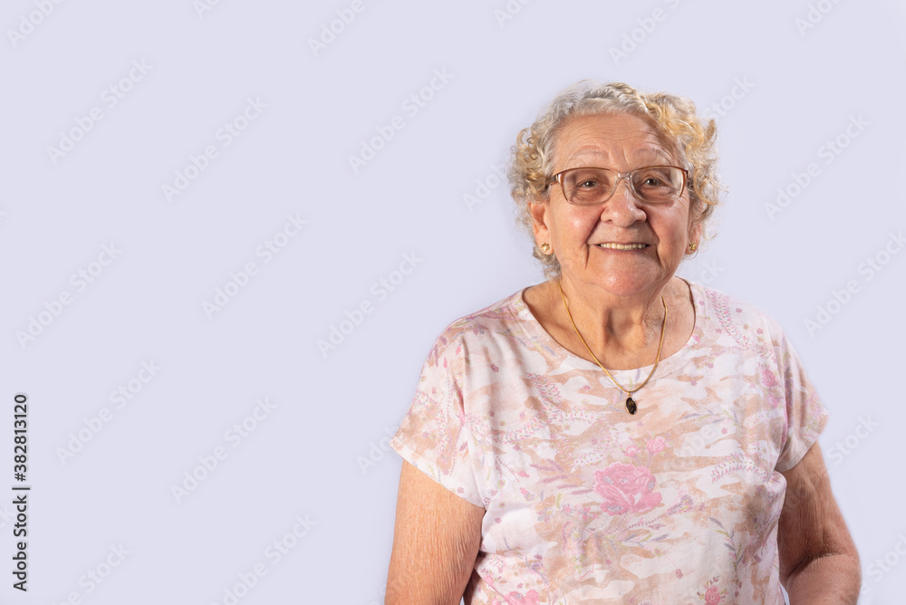 Old lady smiling happy, gray gradient background, selective focus. Old lady smiling happy, gray gradient background, selective focus.