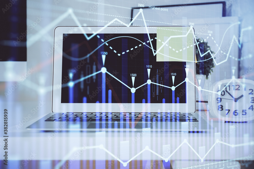 Forex Chart hologram on table with computer background. Double exposure. Concept of financial markets.