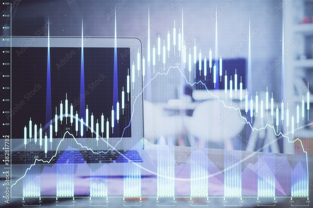 Stock market chart hologram drawn on personal computer background. Double exposure. Concept of investment. Stock market chart hologram drawn on personal computer background. Double exposure. Concept of investment.