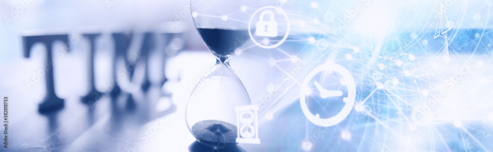 The concept of the passage of time. Hourglass on a dark background. Inscription time. The shadow on the surface of the word. The concept of the passage of time. Hourglass on a dark background. Inscription time. The shadow on the surface of the word.