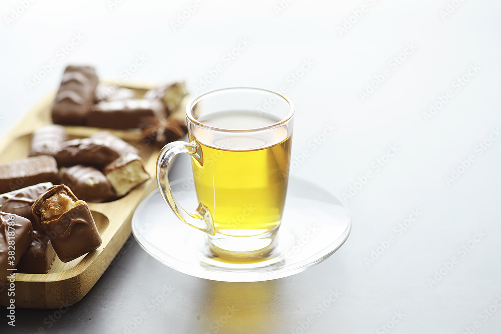 Chocolate bars on a black background in backlight. Chocolate with filling. Sweet sweets for snack and tea. Chocolate bars on a black background in backlight. Chocolate with filling. Sweet sweets for snack and tea.