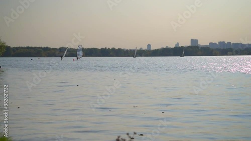 Windsurfing on the lake in Moscow, Strogino. The concept of sports and entertainment. photo