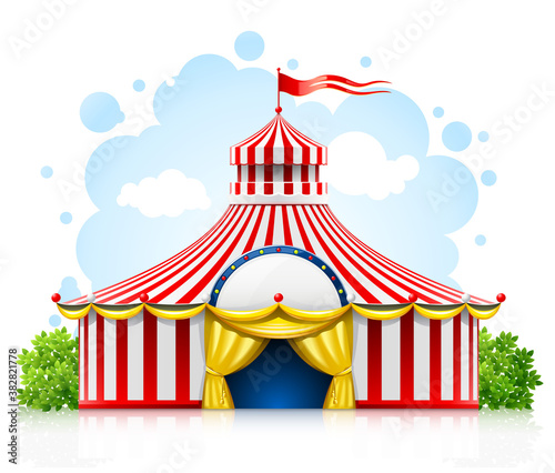 Striped strolling circus marquee tent with flag isolated on white background. photo