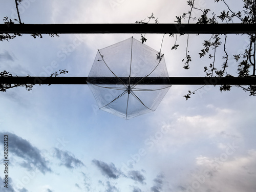 Umbrella hanging on rainy day