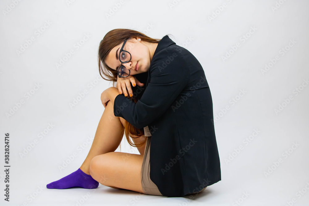 Beautiful girl close-up on grey background in glasses emotions Beautiful girl close-up on grey background in glasses emotions