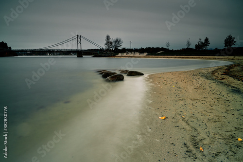At the beach on a overcast day. Kadettangen, Sandvika, Norway. Long exposure of the oslo fjord.