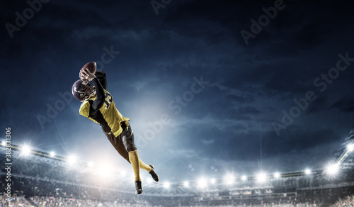 Portrait of confident American football player © Sergey Nivens