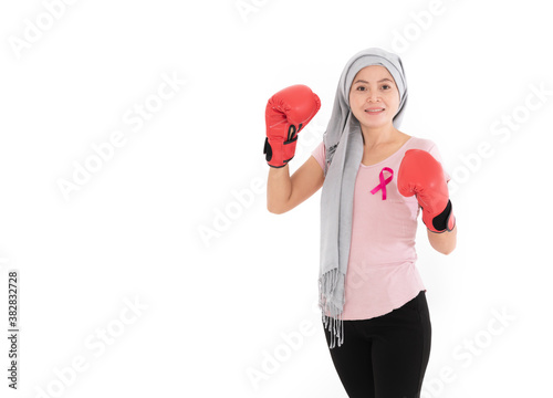 fight breast cancer, women wearing pink ribbons with boxing on white background © chachamp