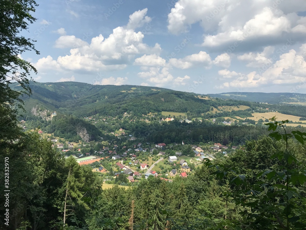 view of a village from mountians on a sunny day