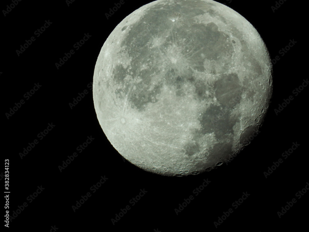 big waning moon with its moon craters in the black night sky big waning moon with its moon craters in the black night sky