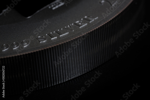 edge of silver coin, extreme close up