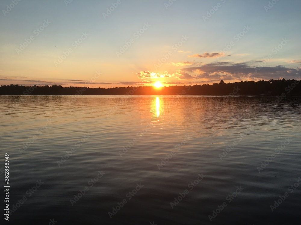 Naklejka premium sunset over the river