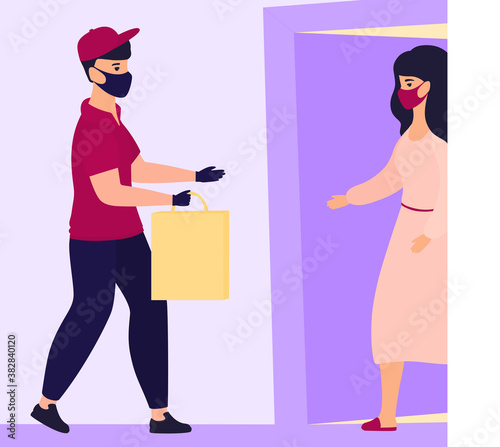 COVID-19. Coronavirus. Safe contactless delivery. Courier in a protective medical mask brought the parcel to the door. Quarantine. Self isolation