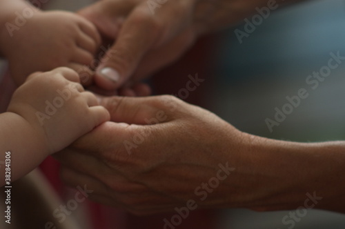 baby's hands in grandmother's hands © Анна Игнатова