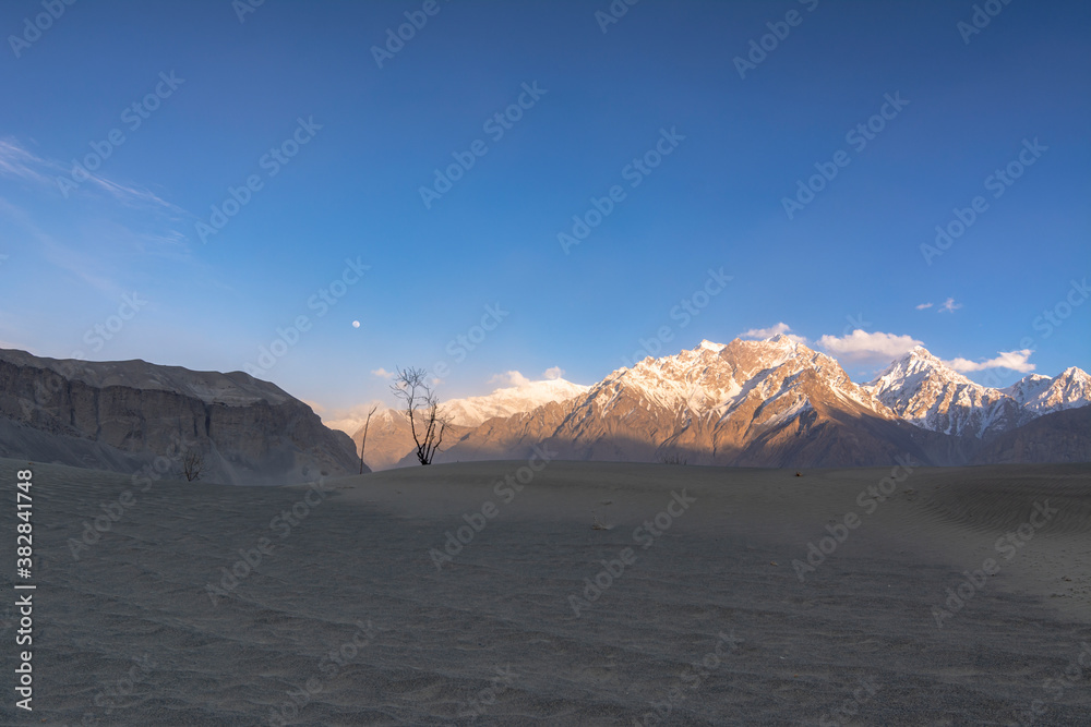 cold desert of katpana with snow mountains in background in northern ...