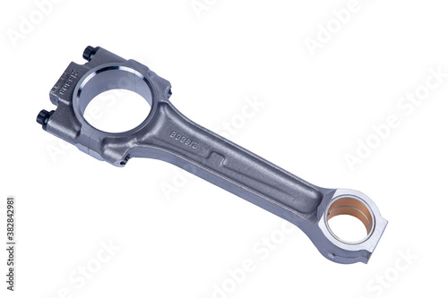 Connecting rod from a car engine. Isolated on white background