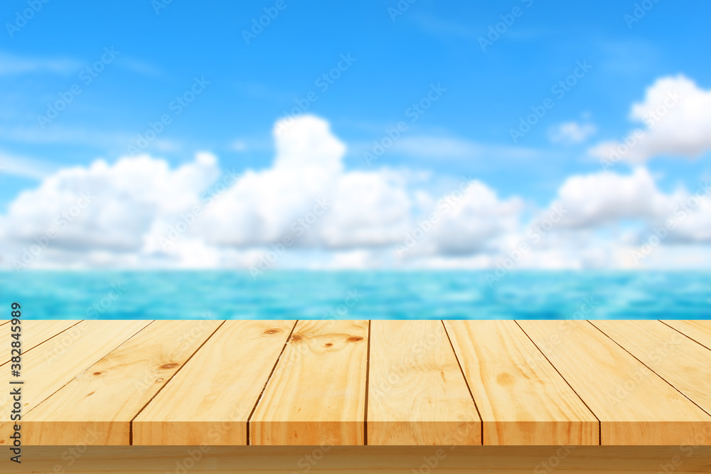 Top of wood table with blurred sea - Empty for product display montage. Concept of beach in summer