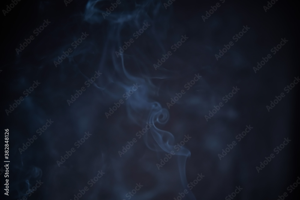 Smoke in motion on dark background Smoke in motion on dark background
