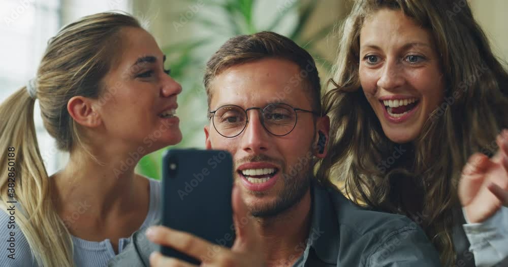 Authentic shot of young happy college friends are making a selfie or video call to relatives or friends with smartphone in a living room at home. Authentic shot of young happy college friends are making a selfie or video call to relatives or friends with smartphone in a living room at home.