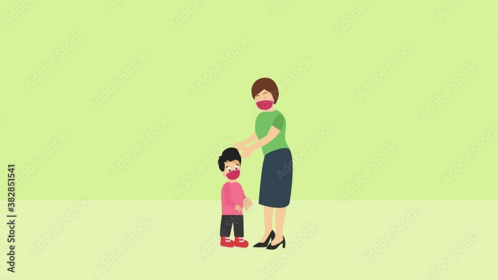 Little boy being worn a face mask by his mother Little boy being worn a face mask by his mother