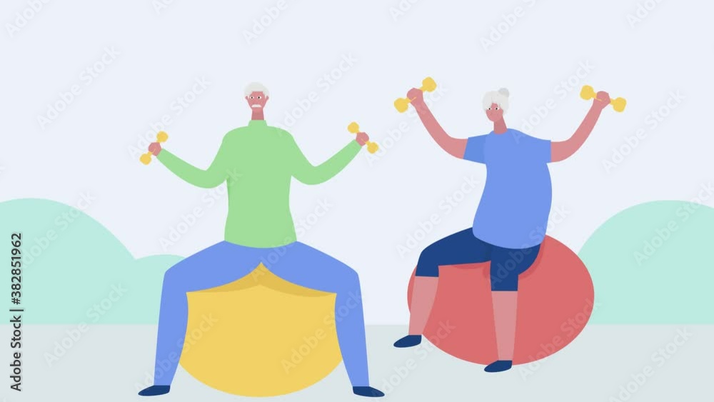 Old couple exercise with dumbbells on fitness ball Old couple exercise with dumbbells on fitness ball