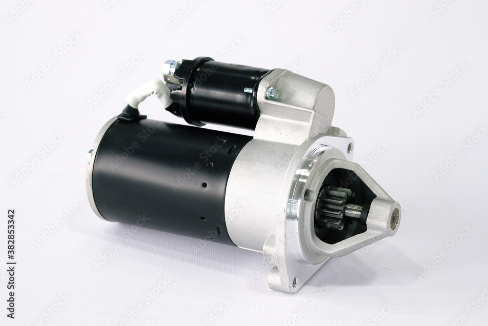 Spare parts, electrical equipment for the car. Car starter on a white background, close-up. Spare parts, electrical equipment for the car. Car starter on a white background, close-up.