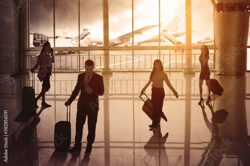 Silhouette of business people walking in airport