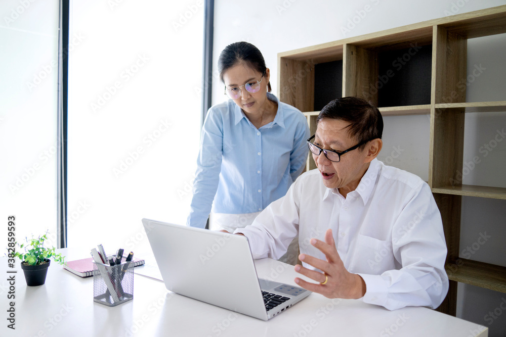 businessman sitting and woman standing talking discussing businessman sitting and woman standing talking discussing