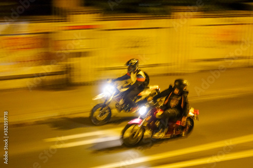 bikers racing at night