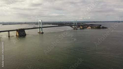 Wallpaper Mural An aerial view of the Throgs Neck Bridge from over the East River. The drone dolly in towards the bridge as it pan left and boom up slowly.  It is a cloudy day & the river is calm. Torontodigital.ca